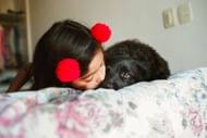Having a dog improves a kid's overall development. (Photo via Pexels/Helena Lopes)